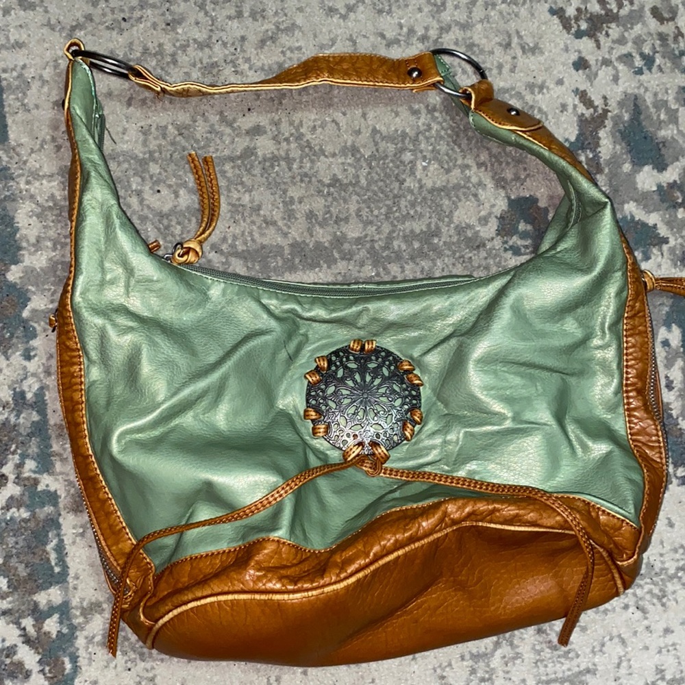 Green and tan leather purse